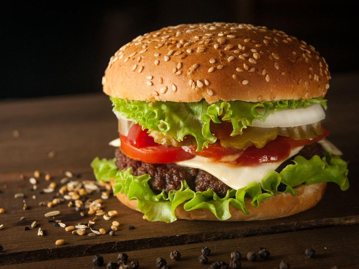 Char-grilled burger with cheese, lettuce and tomato