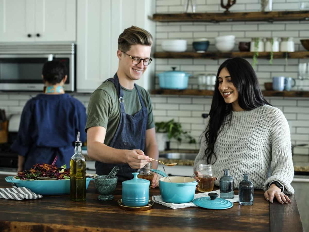 Chefs preparing fresh food in a bright kitchen